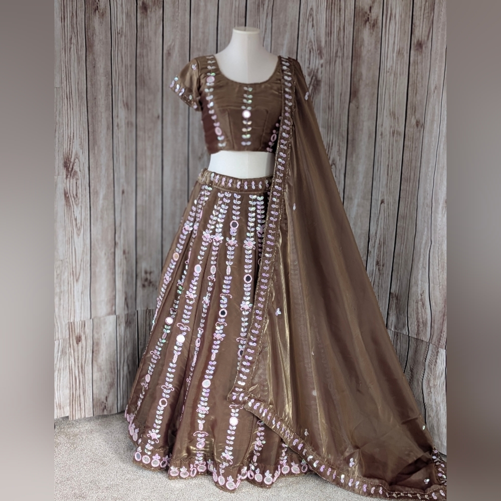 Elegant Brown Embroidered Lehenga Choli with mirror and beads work.